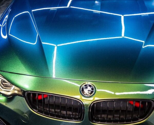 UPPF Gloss Gold & Green installed on the hood of a BMW